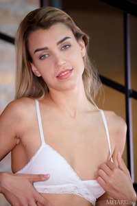 Elena Vedem Takes Off Her Bra To Reveal Lovely Breasts With Tempting Brown Nipples