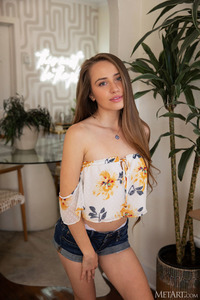 Amber Aura Spreads Her Thighs For A Teasing Glimpse Of The Soft Hair