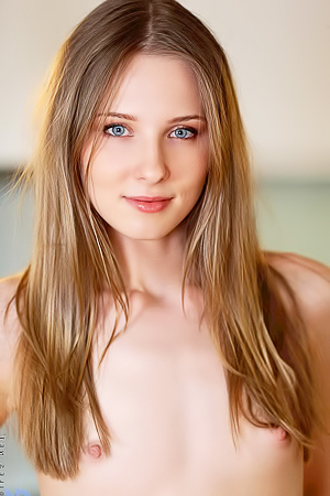 young Russian Nimfa wears only her white fishnet stockings for you