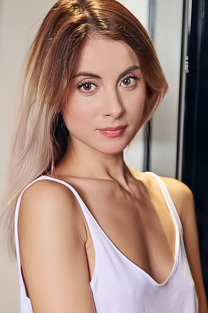 Juck Her shaved pussy looks like a pink flower as she spreads