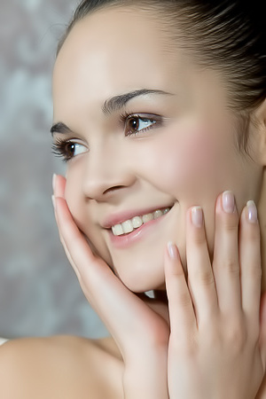 Hot dancer plays with her long legs on the couch.