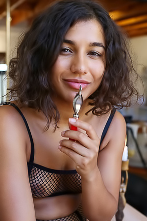 Rubi displays her kinky fishnet lingerie