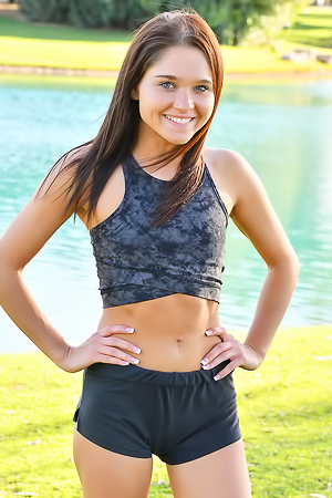 Zoe FTV Sporty Zoe FTV works out on a green lawn
