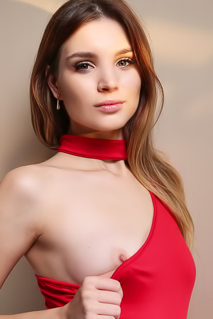 Emilia Hops Gorgeous Ukrainian Brunette Poses In A Simple Red Bodysuit