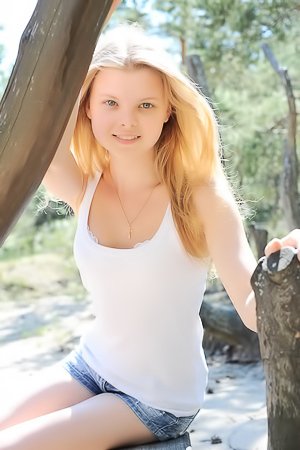 Teen Posing Between Trees