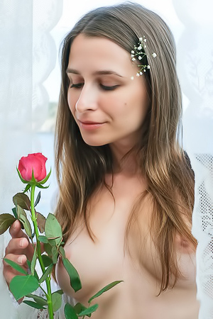 Nyx Sits On The Sofa With Thighs Parted To Frame Her Shaved Pussy