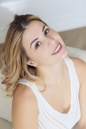 Alice Kelly Dark-eyed Siren Smiles Enticingly As The Straps Slide From Her Shoulders