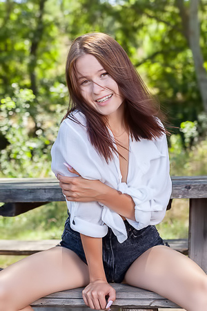 Skye Bloom Perching On A Picnic Table In The Park