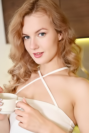 Luna Art Teasingly Lifts Her Dress Revealing Bare Pussy And Perky Breasts Indoors
