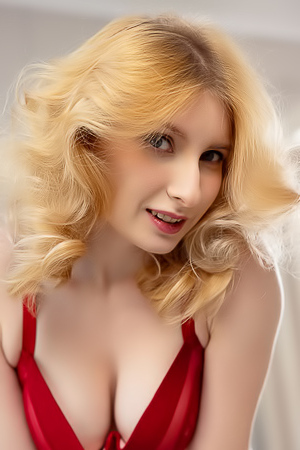 Minnie Lighter Teases On The Couch With Seductive Lingerie And Alluring Curves